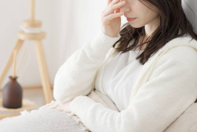 具合の悪そうな女性
