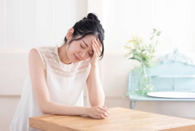 具合の悪そうな女性